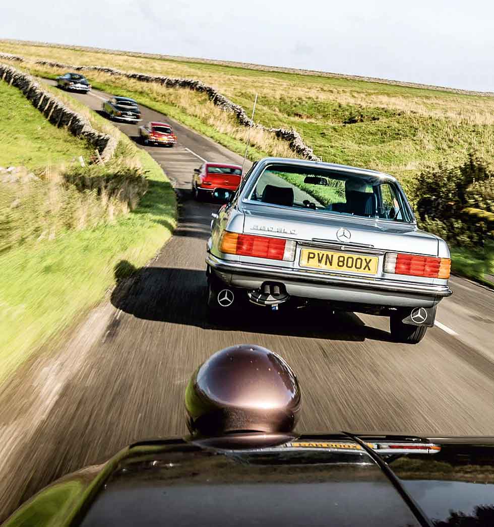 Front to rear: Aston Martin V8, Gordon Keeble GK1, Mercedes-Benz 380SLC C107, Porsche 928 S4, MGB GT V8, Bristol 410
