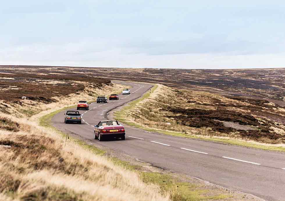 Front to rear: Jensen Interceptor Convertible, Mercedes-Benz E320 Cabriolet A124 (W124), Alvis TD21 Drophead, Ferrari Mondial 3.0QV Cabriolet, VW Golf GTI MkI Cabriolet and Saab 900 Turbo 16S Convertible 